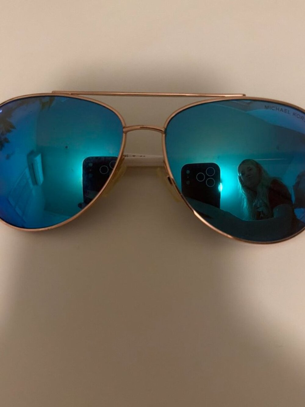Blue mirror pilot glasses from Michael Kors
